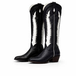 Black cowboy boots with white patterns on a white background