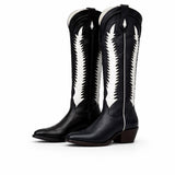 Black cowboy boots with white patterns on a white background