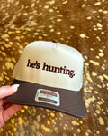 Cream and brown hat with He’s Hunting embroidered in chocolate brown lettering